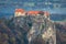 Aerial view of Bled castle located on the rock on the bank of Lake Bled