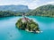 Aerial view of Bled Island or Blejski otok, Assumption of Mary church with a tower and spire, on mountain Bled lake, Slovenia.