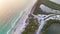 Aerial view of Blind Pass beach on Manasota Key, USA. Many people enjoying vacation time swimming in gulf water and