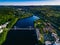 Aerial view of blue lake with cable-stayed bridge and green summer town in Finland