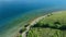 Aerial view of blue ocean coastline with road near shore in Sumbawa