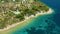 Aerial view of a blue ocean near a cliffy shore at daytime