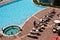 Aerial View of Blue Pool at Hotel with Sunbathers.