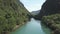 Aerial view blue river in canyon among jungle banks