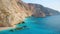 Aerial view of blue sea, rocks, sandy beach at sunny day