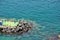 Aerial view of blue transparent seawater around a pontoon in Sorento