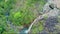 Aerial View of Blue Waterfall Lake and Mountain River Trees