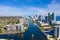 Aerial view of boat on Miami Beach canal with a flock of crows