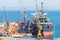 Aerial view of boat in the process of unloading wood chips carrier to the port of Setubal