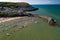 Aerial view of boats and the beach at the colorful Welsh seaside town of New Quay in Cardigan Bay