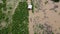 Aerial view of boats and houses flooded in rural Thailand. Top view of the river flowing after heavy rain and flooding in the vill