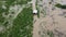 Aerial view of boats and houses flooded in rural Thailand. Top view of the river flowing after heavy rain and flooding in the vill