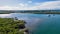 Aerial view of boats and ships in Hastings River and lush green forests in Port Macquarie, Australia