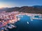 Aerial view of boats and yachts and beautiful city at sunset