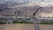 Aerial view of Bordeaux cityscape on banks of Garonne river overlooking Gothic spire of Basilica of St. Michael, France