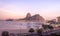 Aerial view of Botafogo, Guanabara Bay and Sugar Loaf Mountain with a pink sunset - Rio de Janeiro, Brazil