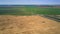 Aerial view boundless landscape with road crossing fields