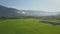 Aerial View Boundless Rice Fields among Plants against Hills