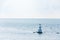 Aerial view of bouy floating in open sea