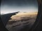 Aerial view of the Brazilian city of Rio de Janeiro, with window and airplane wing.