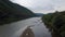 Aerial view, bride and groom, the river on the mountain in the Carpathians