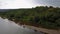 Aerial view, bride and groom, the river on the mountain in the Carpathians