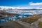 Aerial view of the bridge, glacial lagoon and icebergs. Iceland in early spring