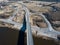 Aerial view of bridge and highway with intersection and roundabout  on a sunny spring day, Kuldiga, Latvia