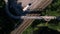 Aerial view of a bridge over railway tracks in North Vancouver, BC, Canada. Zoom out