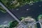 Aerial view of the bridge and the road over the Dnepr River over a green island in the middle of the river