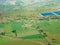 Aerial view, bright green grassy fields