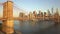 AERIAL: View of Brooklyn Bridge in Beautiful Golden Orange Sunset Light in New York City