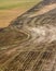 Aerial view of brown cropland recently harvested