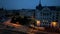 Aerial view of Budapest Tram passing through city neighbourhood during blue hour