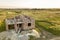 Aerial view of building site for future house, brick basement floor and stacks of brick for construction