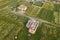 Aerial view of building site for future house, brick basement floor and stacks of brick for construction