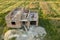 Aerial view of building site for future house, brick basement floor and stacks of brick for construction