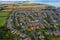 Aerial View of buildings and the mere in the seaside town of Hornsea during Summer of 2019