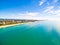 An aerial view of Burleigh Beach on a clear day with blue water