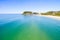 An aerial view of Burleigh Beach on a clear day with blue water