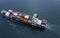 Aerial view of a business container cargo ship in import export business commercial trade logistic which a containers in a harbor