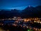 Aerial view of Busteni city covered with snow in winter at night, Romania