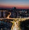 Aerial view of the bustling cityscape of Wuhan, China during rush hour at dusk.