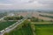 Aerial view of a bustling highway featuring numerous cars traveling on each side of the roadway