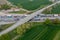 Aerial view of a bustling highway featuring numerous cars traveling on each side of the roadway