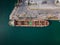 aerial view of a bustling seaport, where a massive cargo ship, a bulk carrier, is being loaded with wheat grains