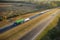 Aerial view of busy american freeway with fast moving cars and trucks. Interstate hauling of goods concept
