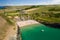 Aerial view of a busy beach and bay in West Wales Mwnt, Ceredigion