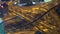 Aerial view of busy highway intersection & junction at night,