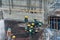 Aerial view of busy industrial construction site workers with cranes working. Top view of development high rise architecture